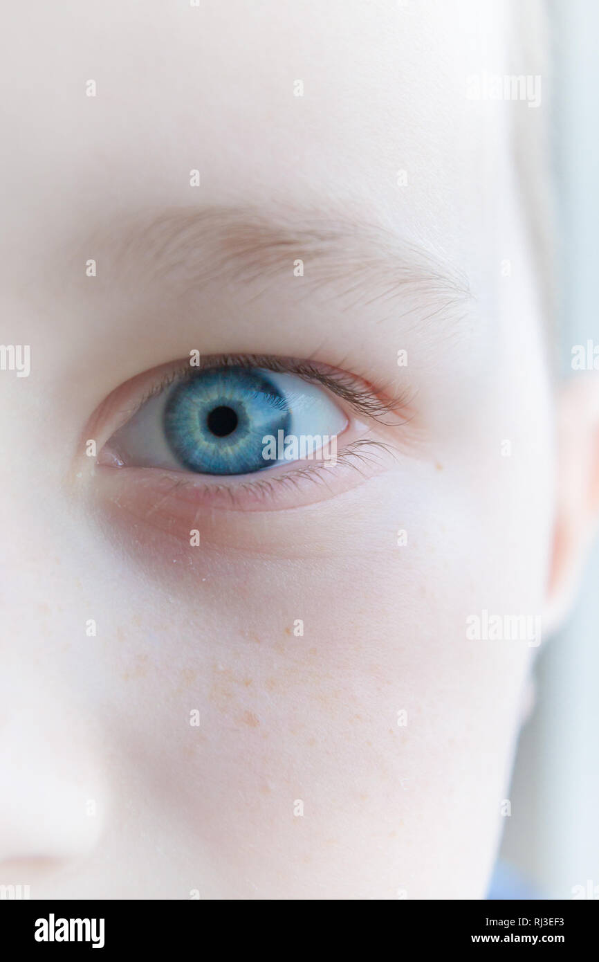 Baby blue beautiful, brooding eyes of a boy Stock Photo - Alamy