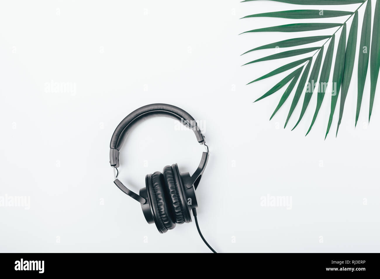 Black headphones on white table next to 