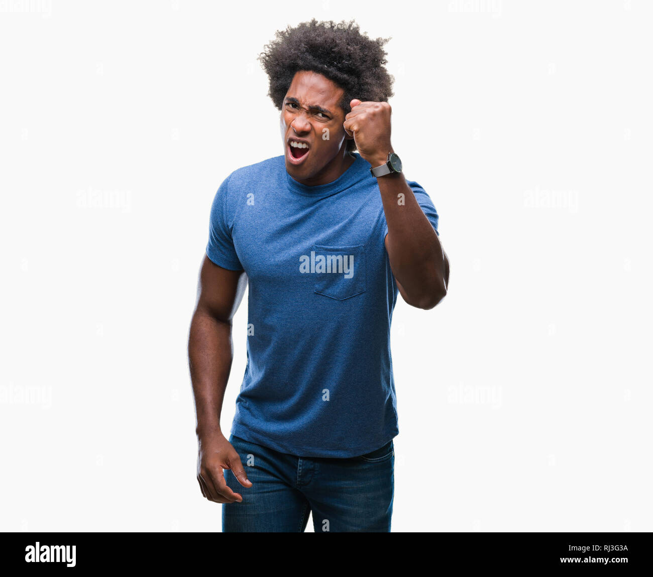 Afro american man over isolated background angry and mad raising fist ...