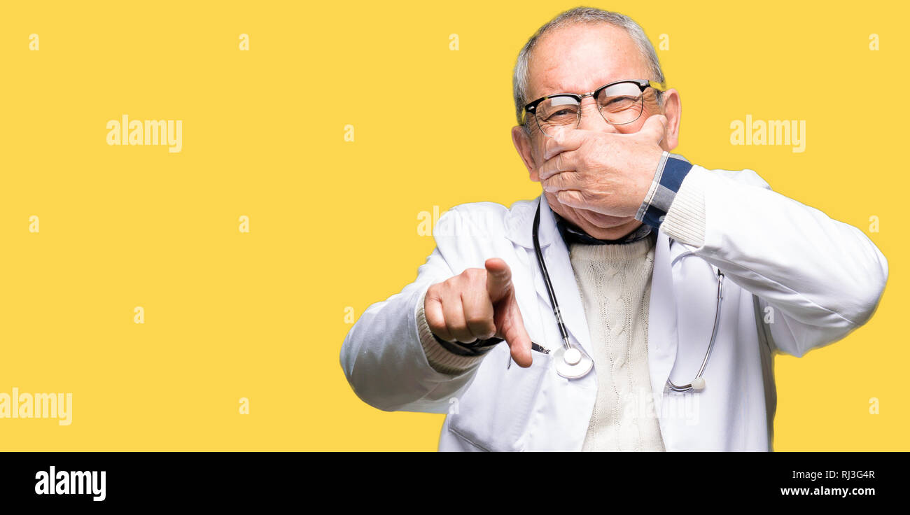 Old man pointing mouth hi-res stock photography and images - Alamy