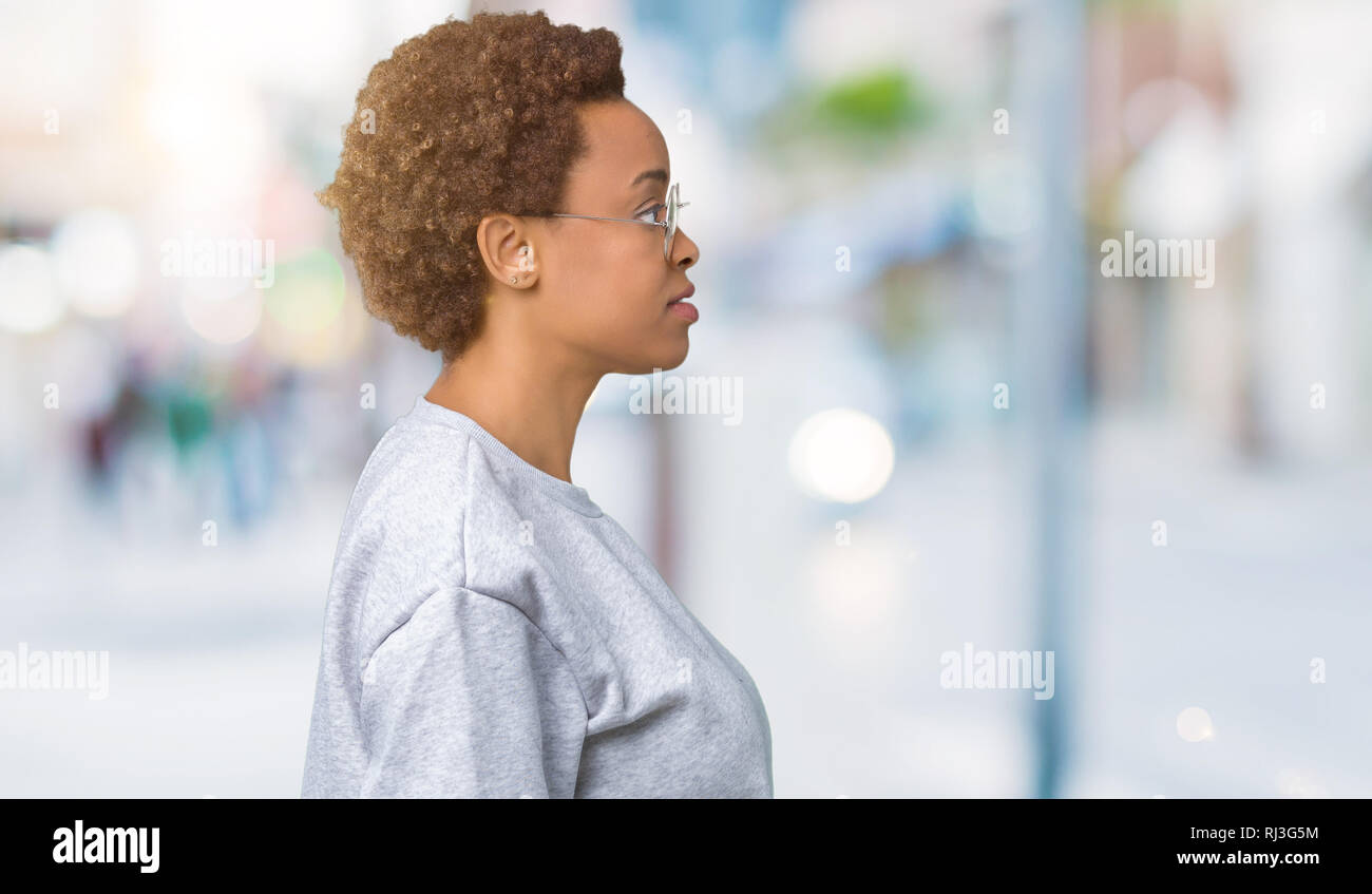 Young beautiful african american woman wearing glasses over isolated ...