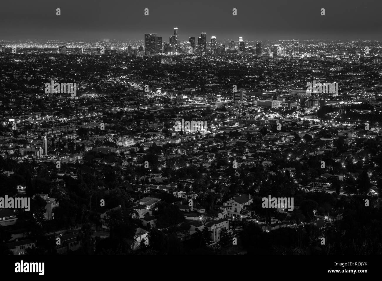 View of the downtown Los Angeles skyline at night, from Griffith Observatory, in Griffith Park, Los Angeles, California. Stock Photo