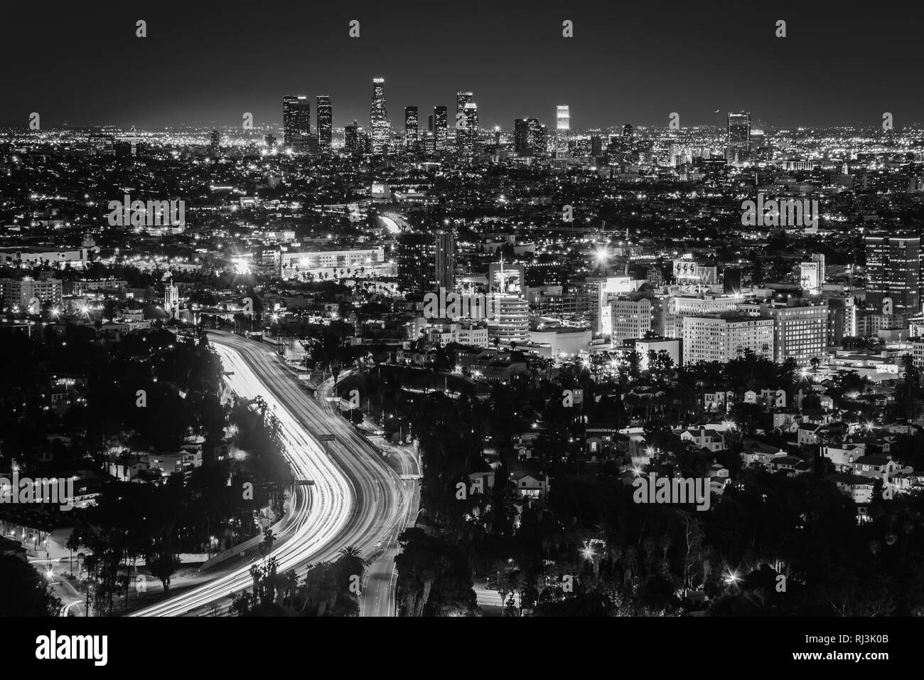 View of the Los Angeles Skyline and Hollywood at night from the Hollywood Bowl Overlook, in Los Angeles, California. Stock Photo
