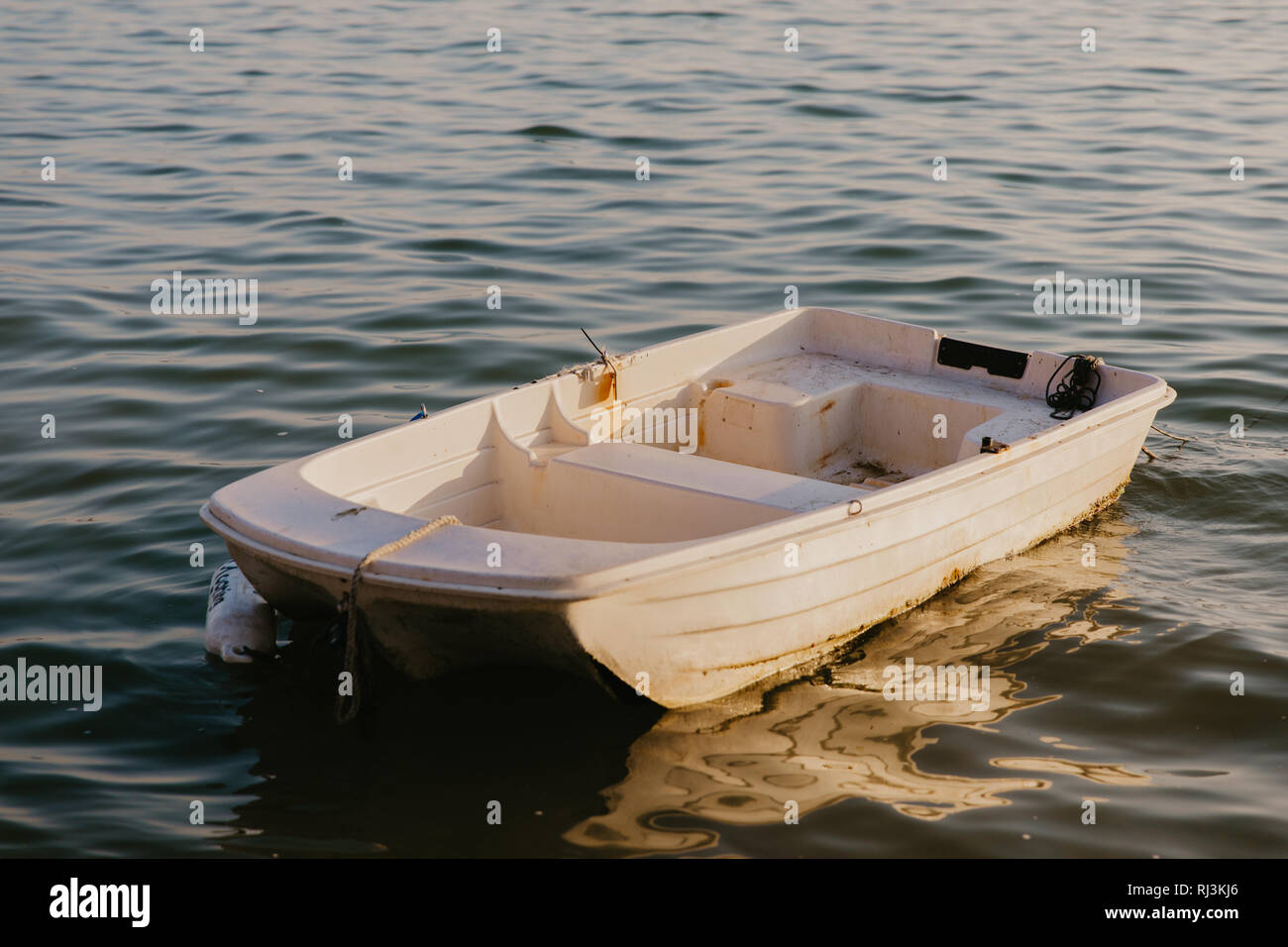 Rowboat on calm water hi-res stock photography and images - Alamy