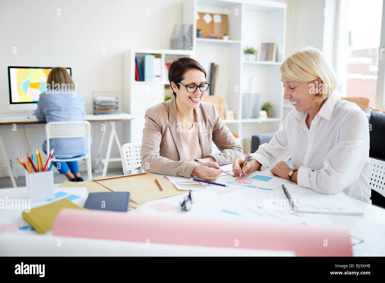 Businesswomen Discussing Project Stock Photo