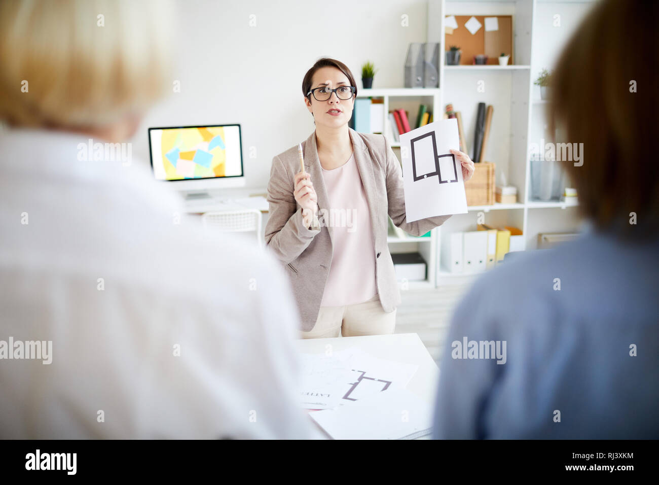 Colleagues Discussing design Stock Photo