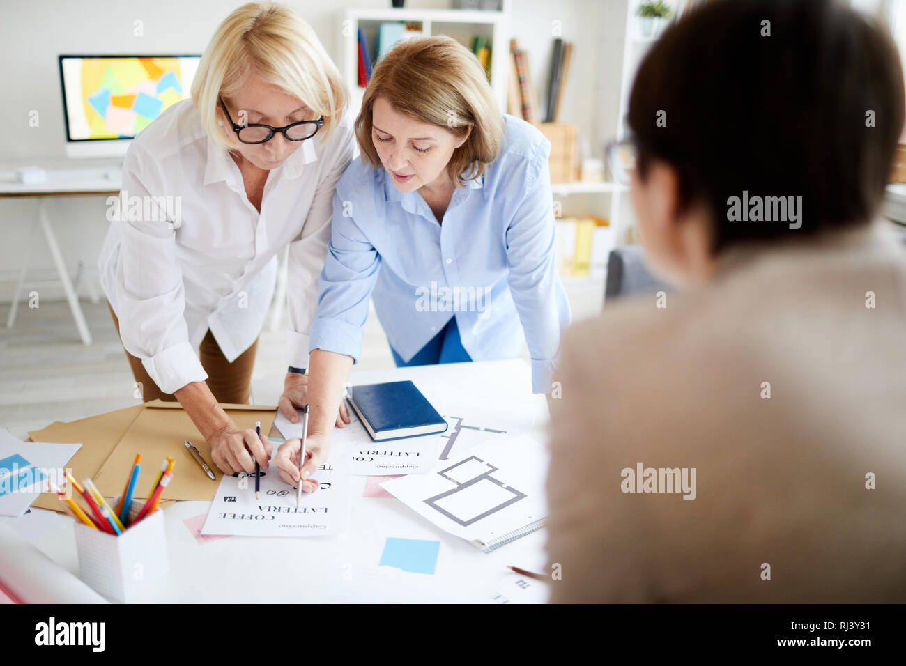 Female Designers Collaborating Stock Photo