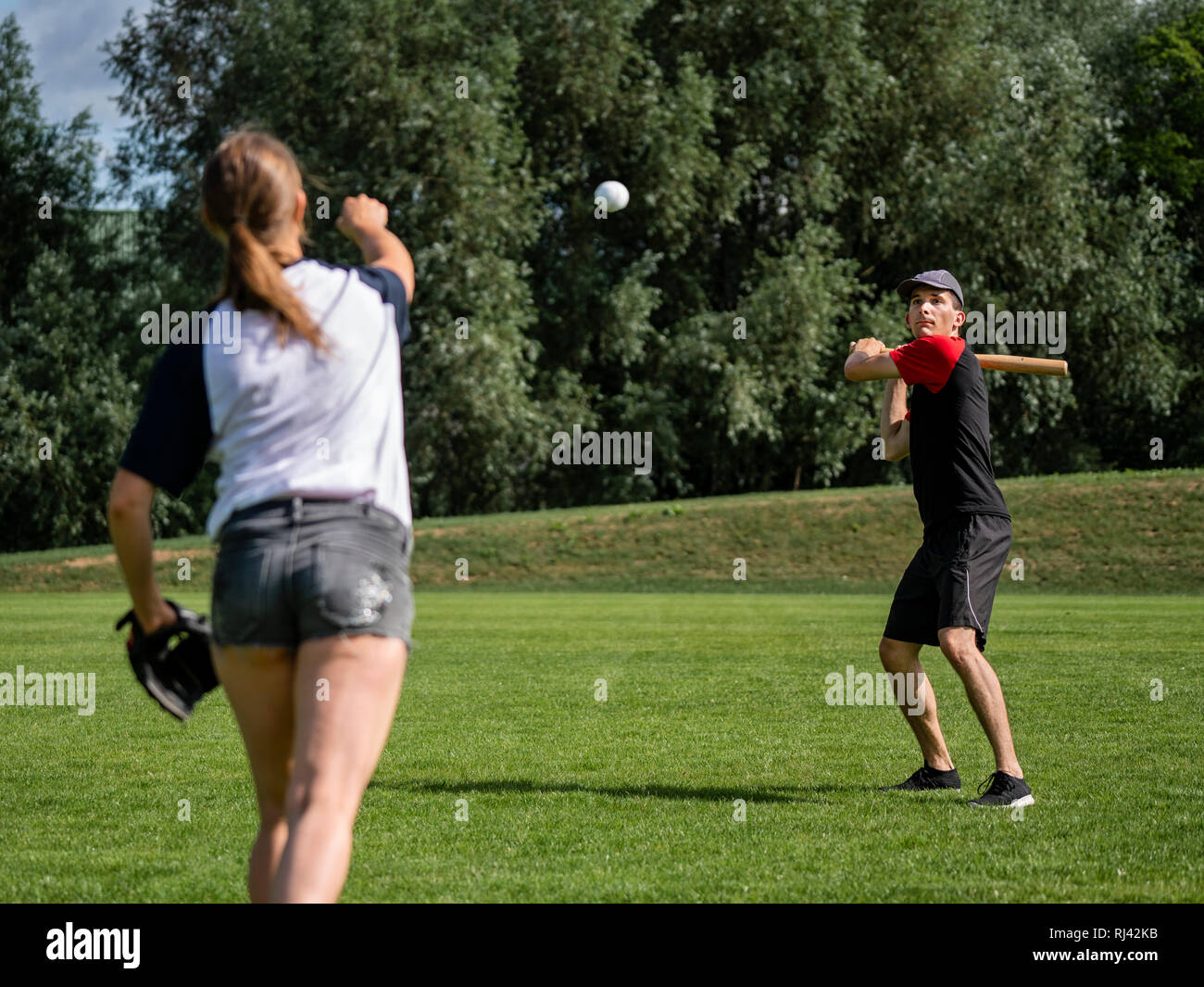 Young couple is playing baseball Stock Photo