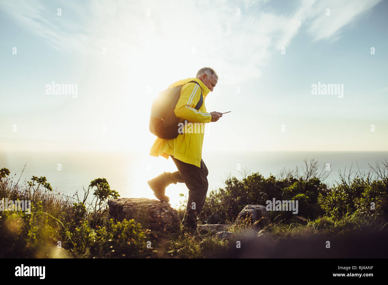 Senior male walking side view hi-res stock photography and images - Alamy
