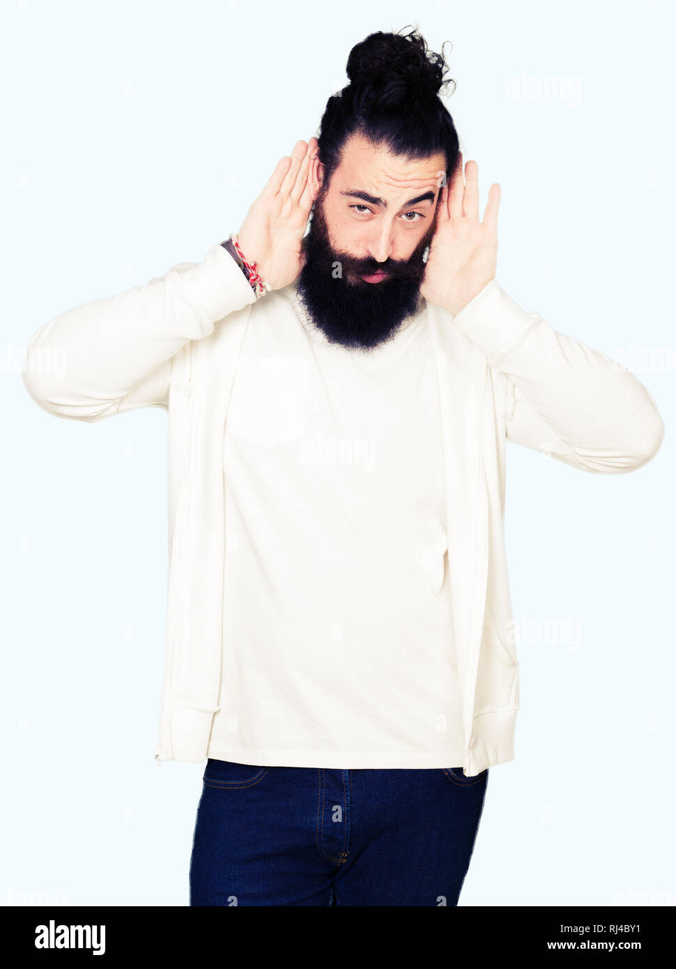 Young Hipster Man With Long Hair And Beard Wearing Sporty