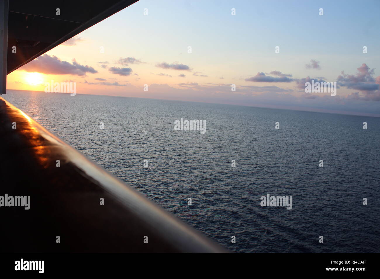 Beautiful sunset upon the Atlantic Ocean seen from a cruise ship. Stock Photo
