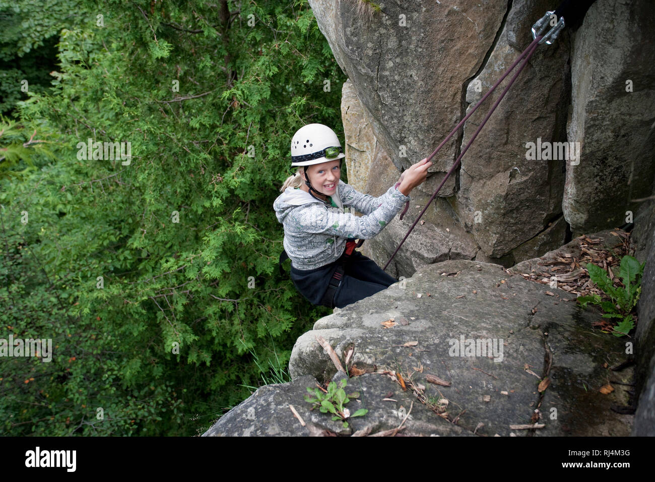 girl rock climbing Stock Photo