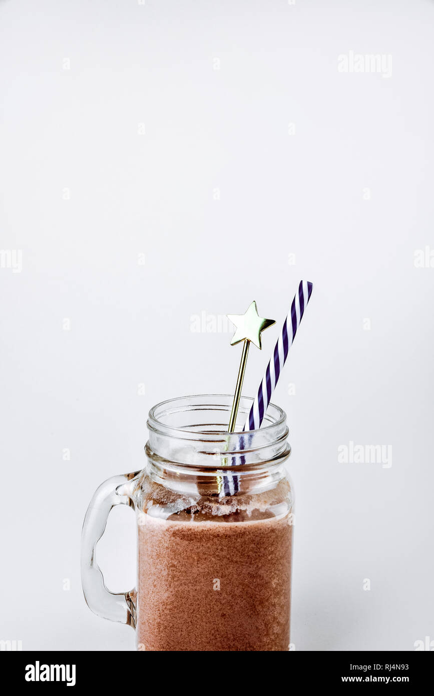 Protein shake, smoothie with chocolate and cocoa in a jar on a white background Stock Photo