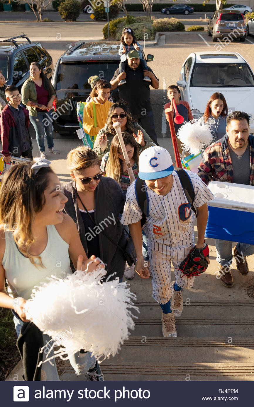 Baseball player and family arriving for game Stock Photo