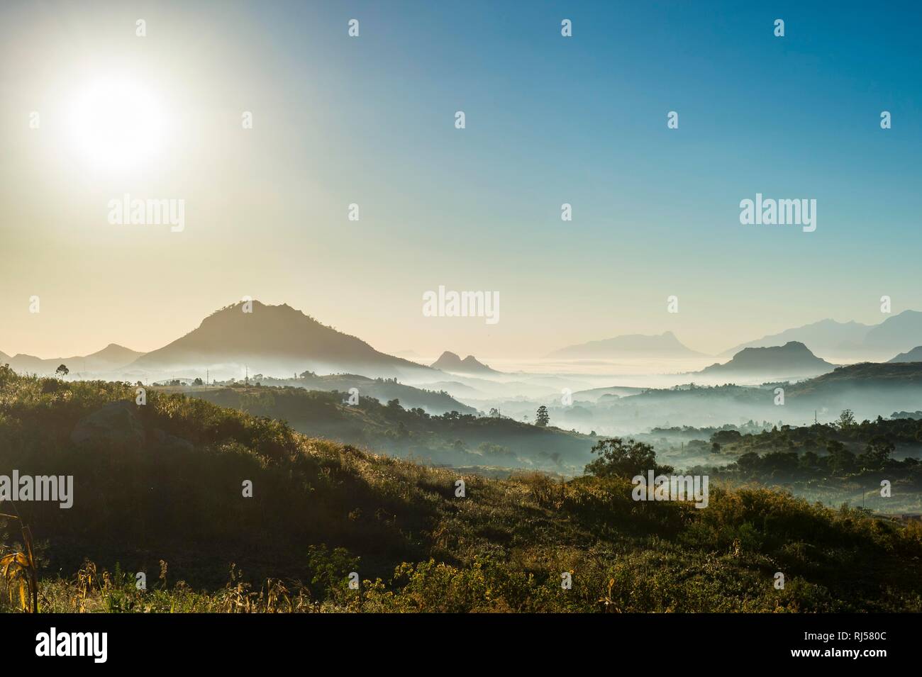 Fog over the mountains at sunrise, surrounding Blantyre, Malawi Stock Photo