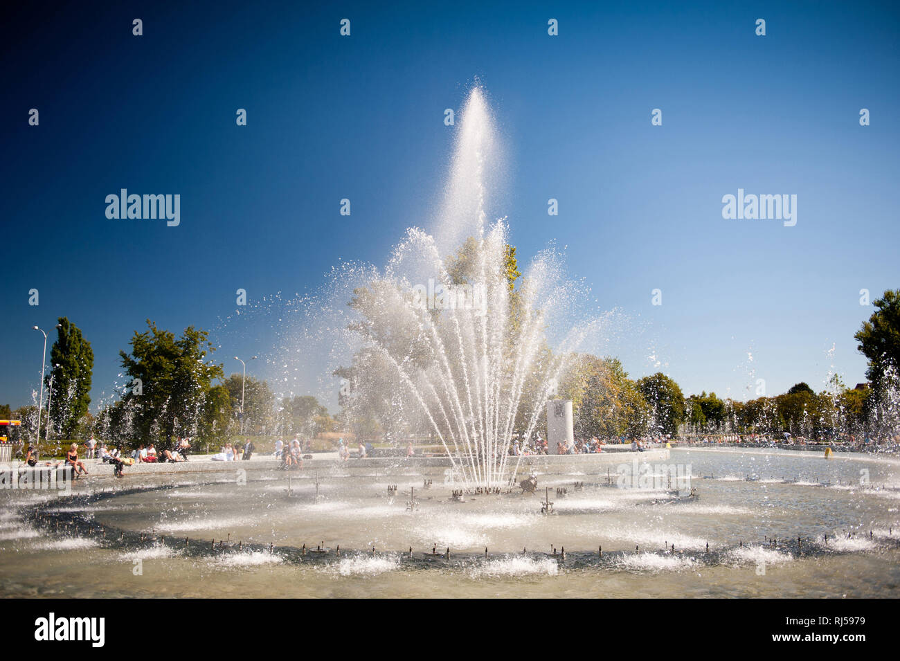 Big Multimedia Fountain Park in Warsaw Old Town down, tourist seasonal attraction, summertime in Poland, blue sunny sky, water splashing, warm day, Po Stock Photo