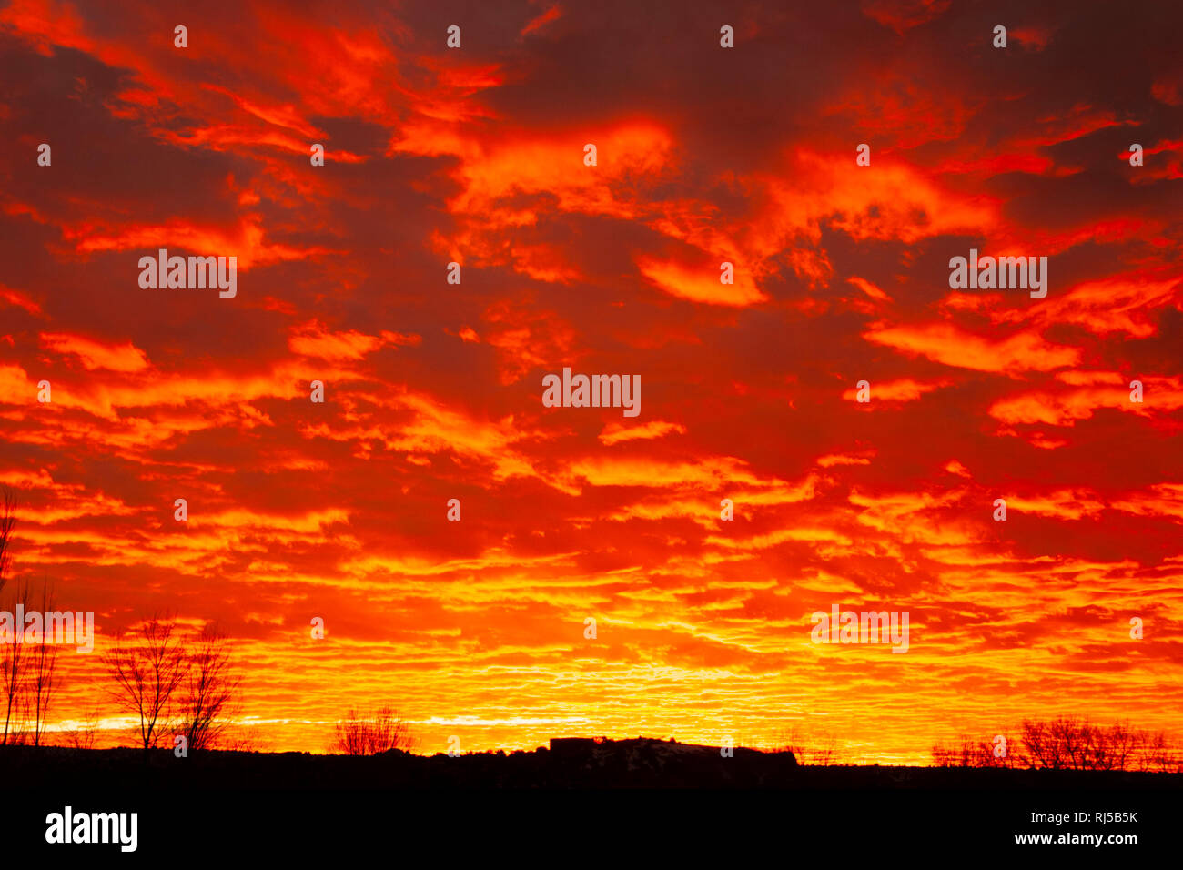 Flaming sunset clouds Stock Photo