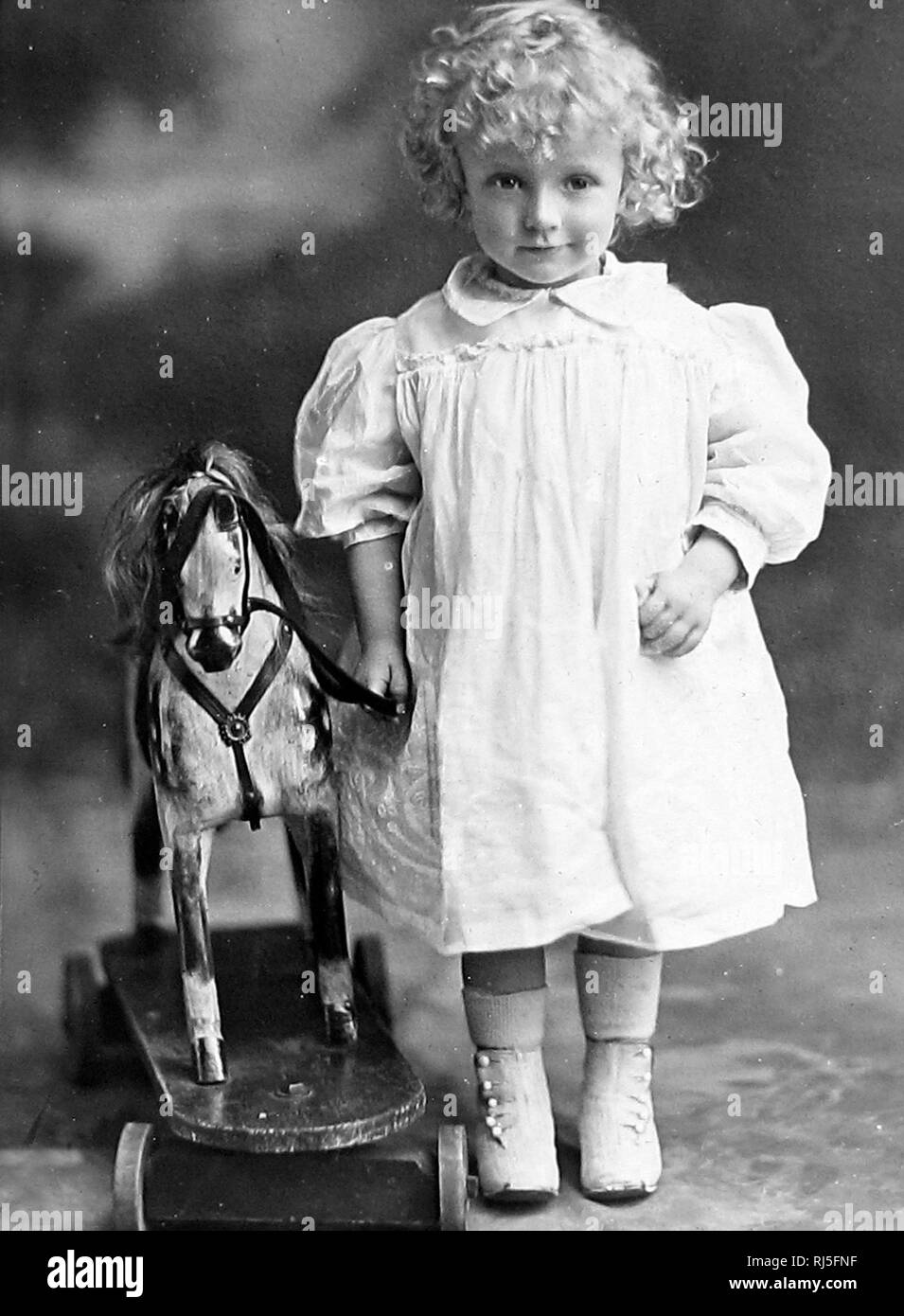 Studio portrait of girl with toy Stock Photo - Alamy