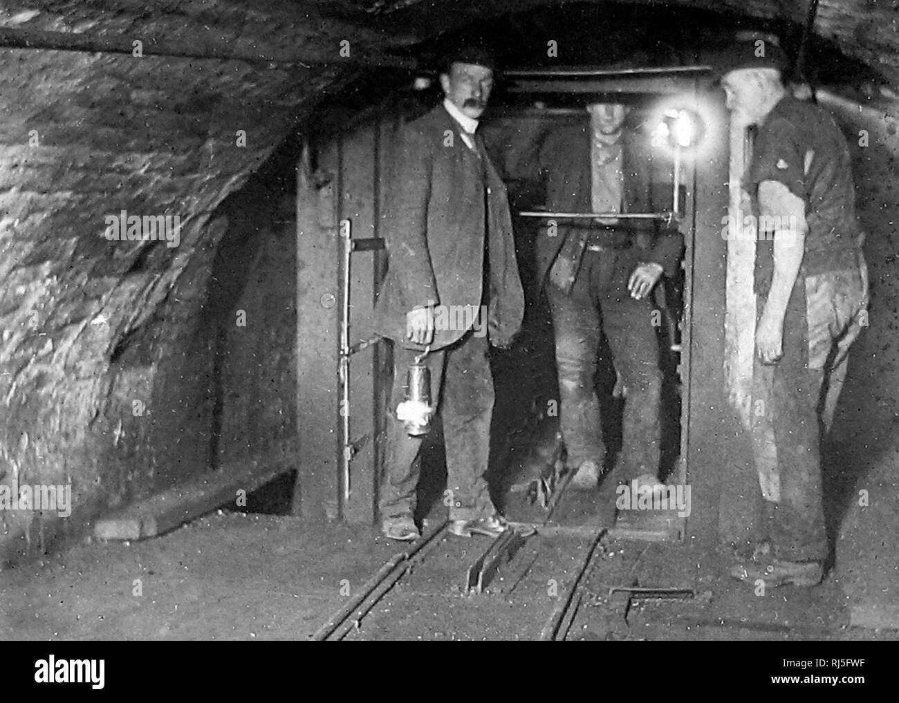 Cage at bottom of shaft in a coal mine Stock Photo - Alamy