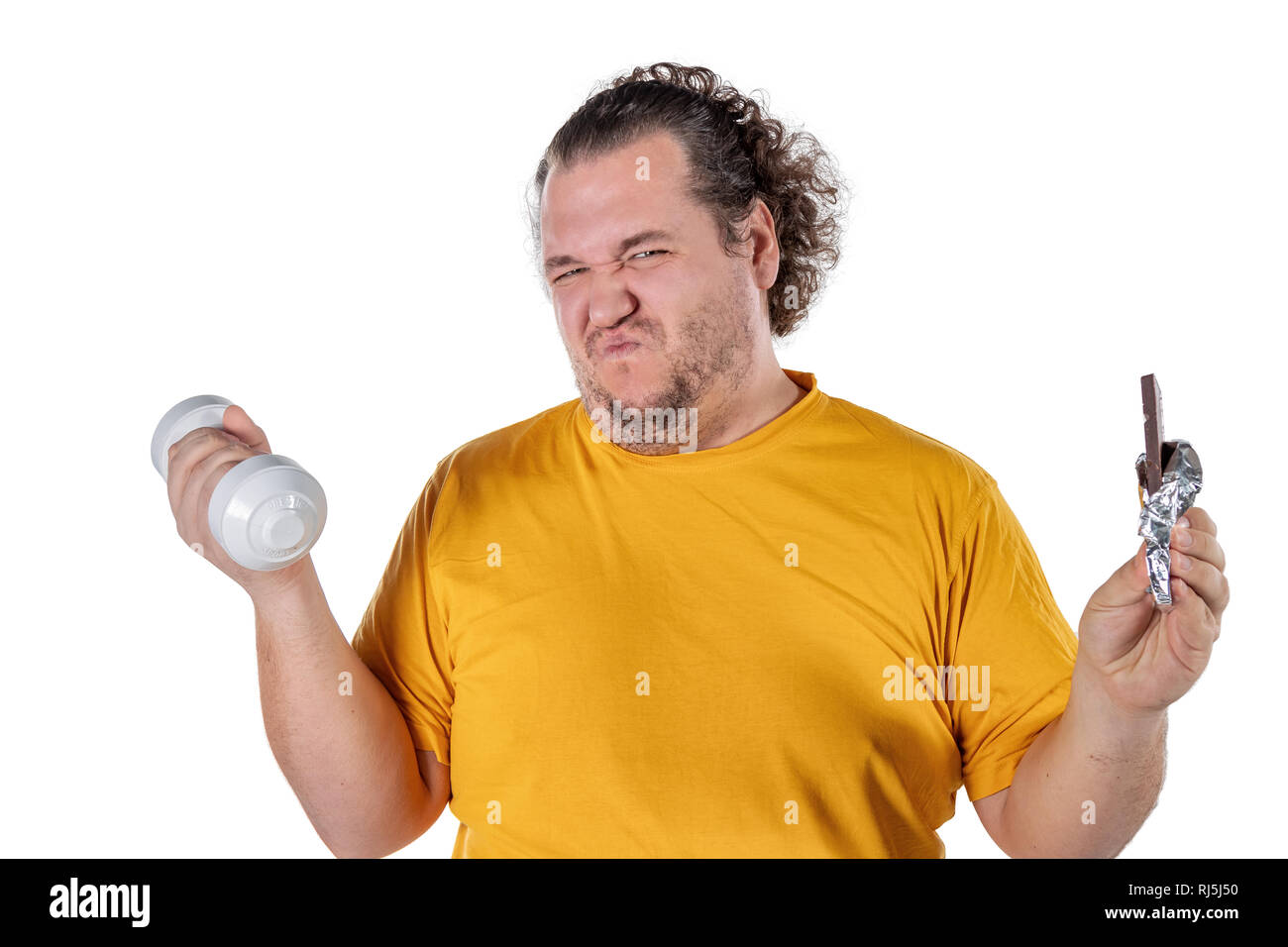 Funny fat man eating unhealthy food and trying to take exercise