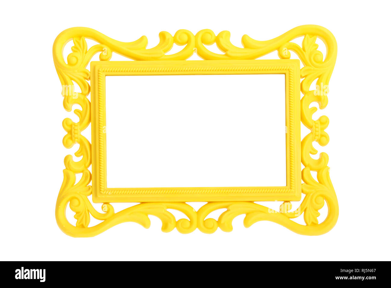 Modern plastic bright yellow picture frame with antique styling isolated on white background. Stock Photo