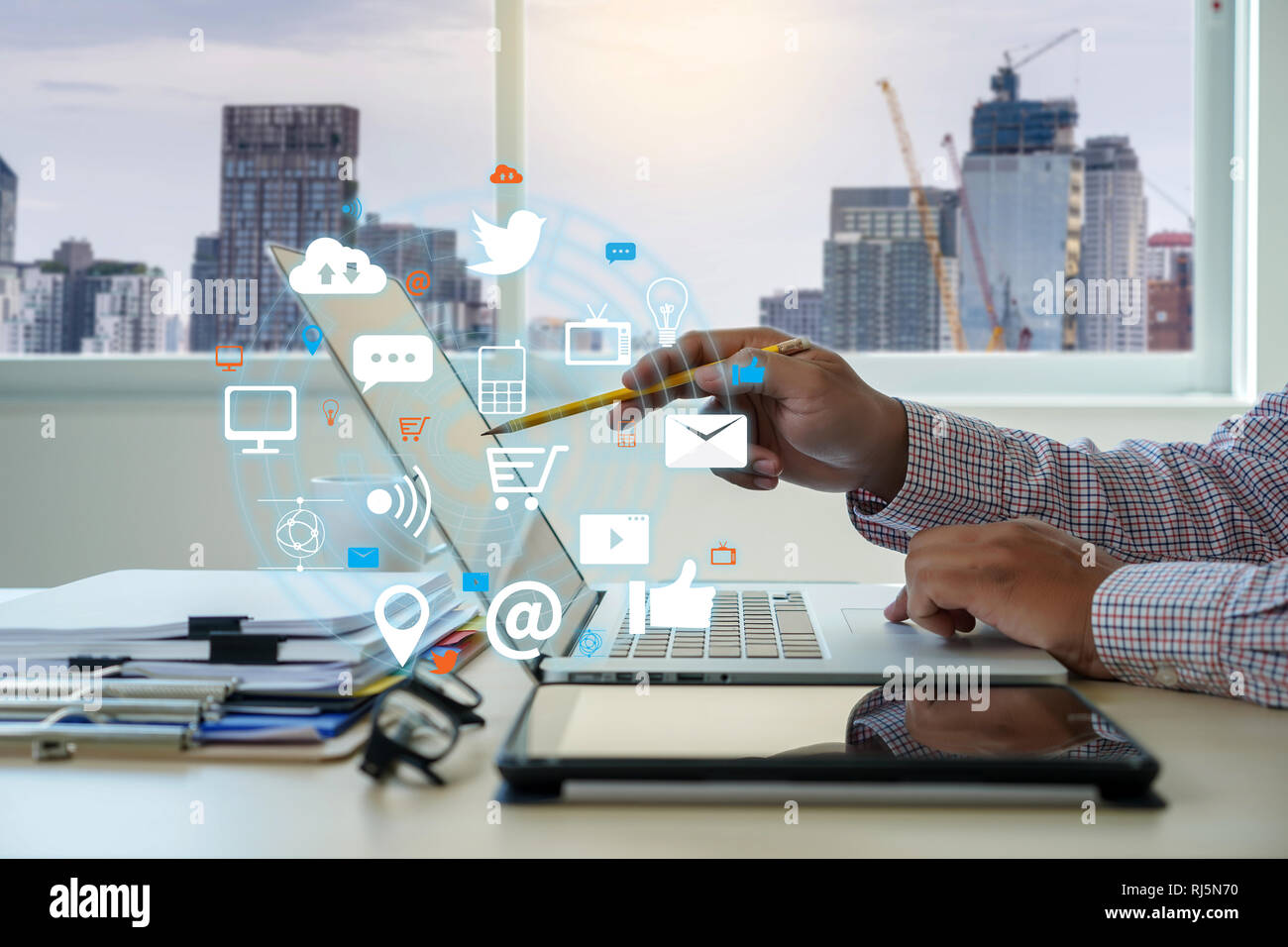Man using  tablet computer  virtual interface graphic icons network diagram Digital marketing Stock Photo