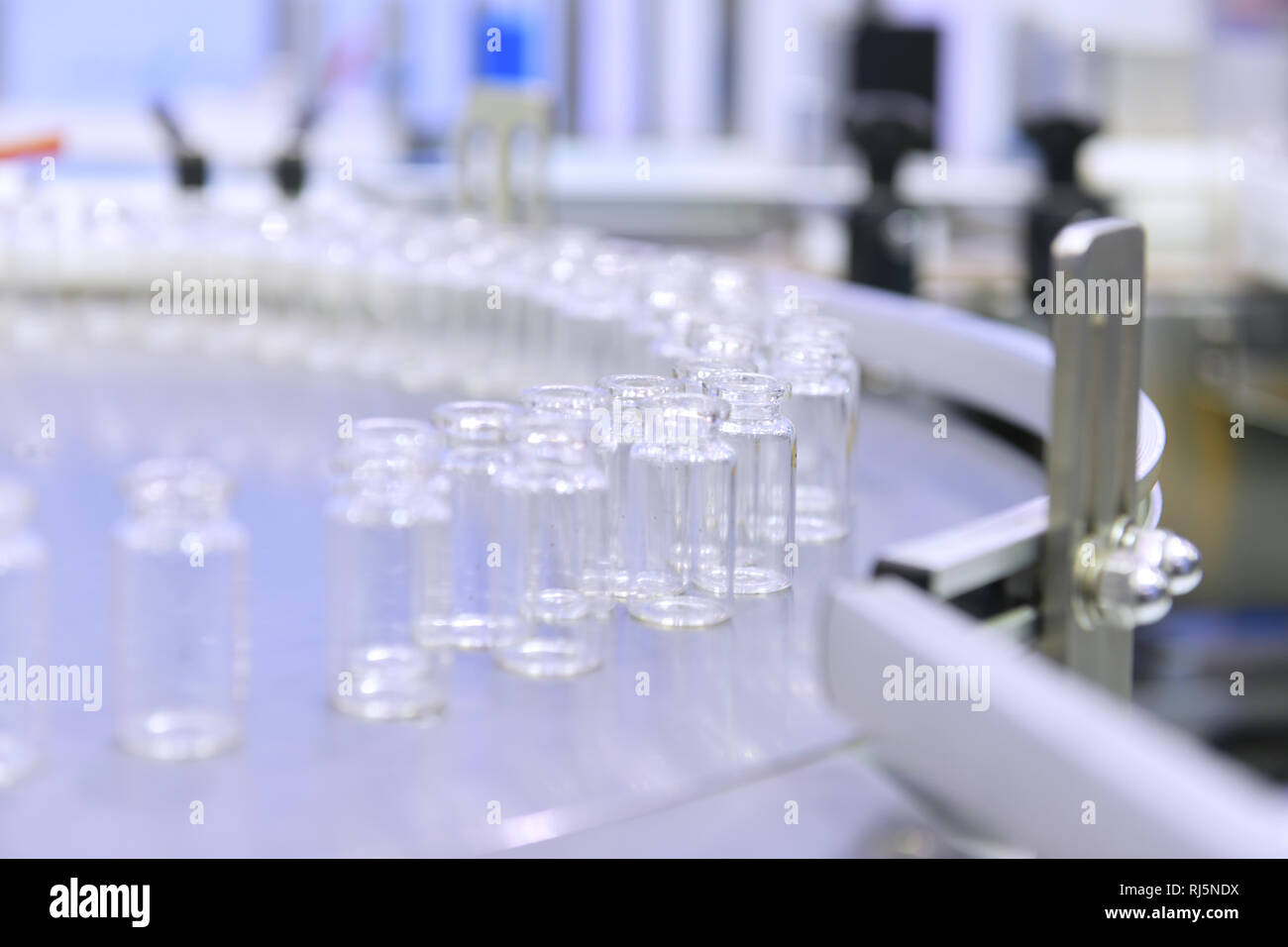 Clear Glass bottles transfer on Automated conveyor systems industrial