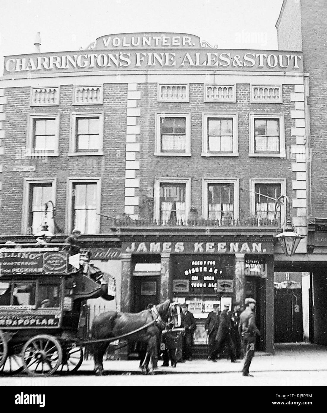 The Volunteer pub, Poplar, London & a Tilling horse bus Stock Photo