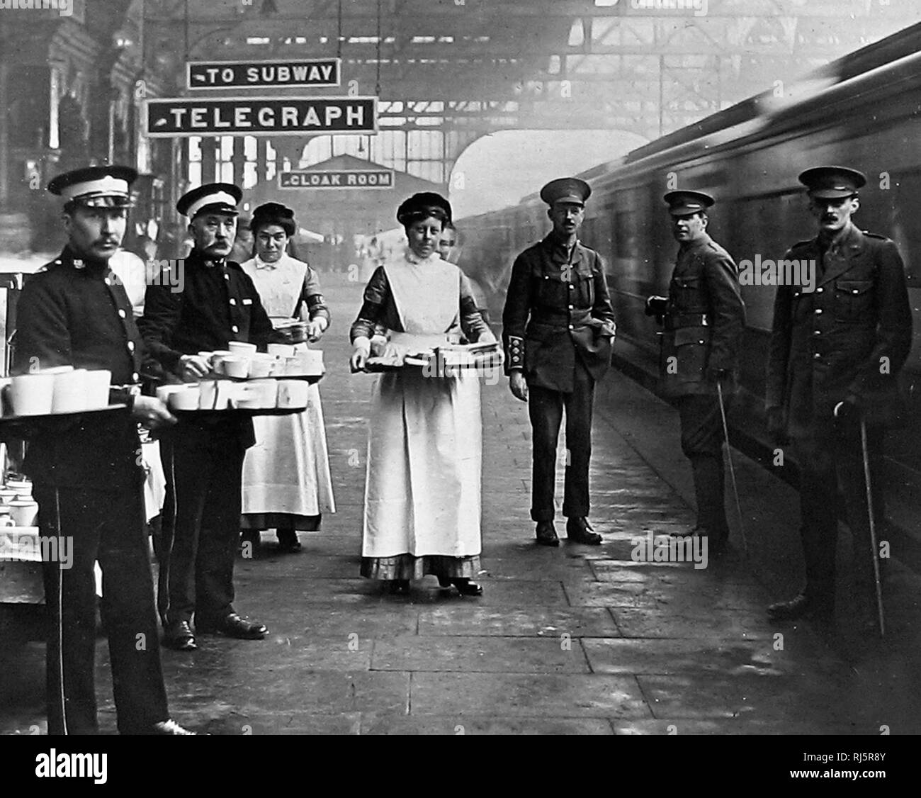 A WW1 Red Cross and St. Johns Ambulane Brigade volunteers at a railway station Stock Photo