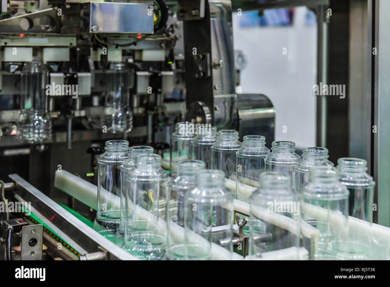 Clear Glass bottles transfer on Automated conveyor systems industrial