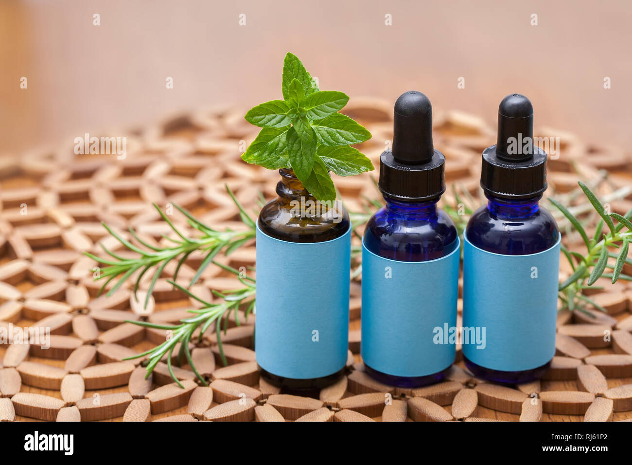 A homeopathic preparation in three glass bottles with screw on dropper and blank labels. Stock Photo