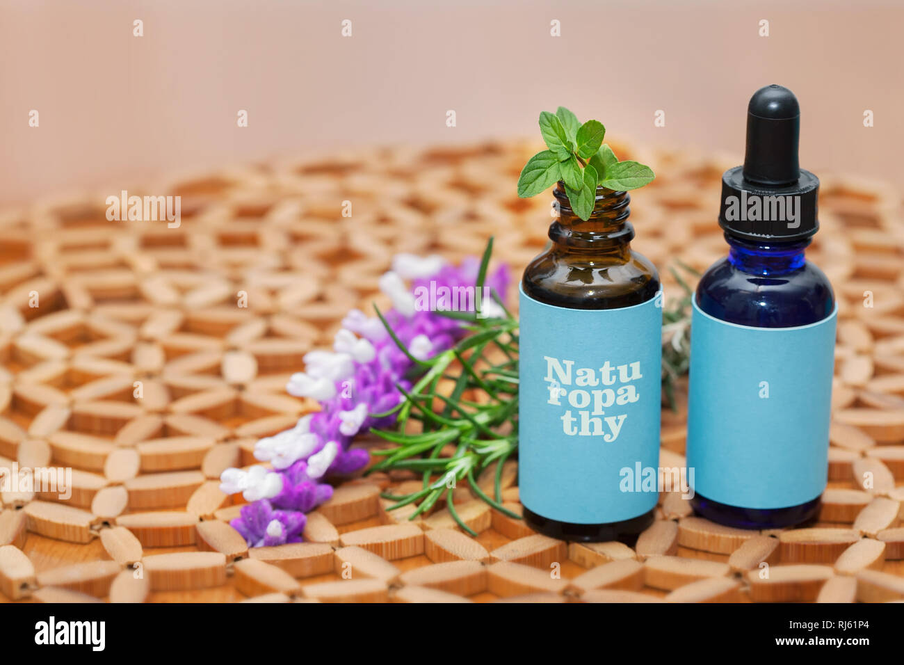 Naturopathic medicine concoctions in glass bottles with natural plants and herbs. Stock Photo