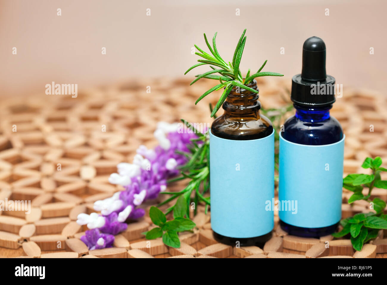 Naturopathic medicine showing a holistic approach using natural plants and herbs in glass bottles. Stock Photo