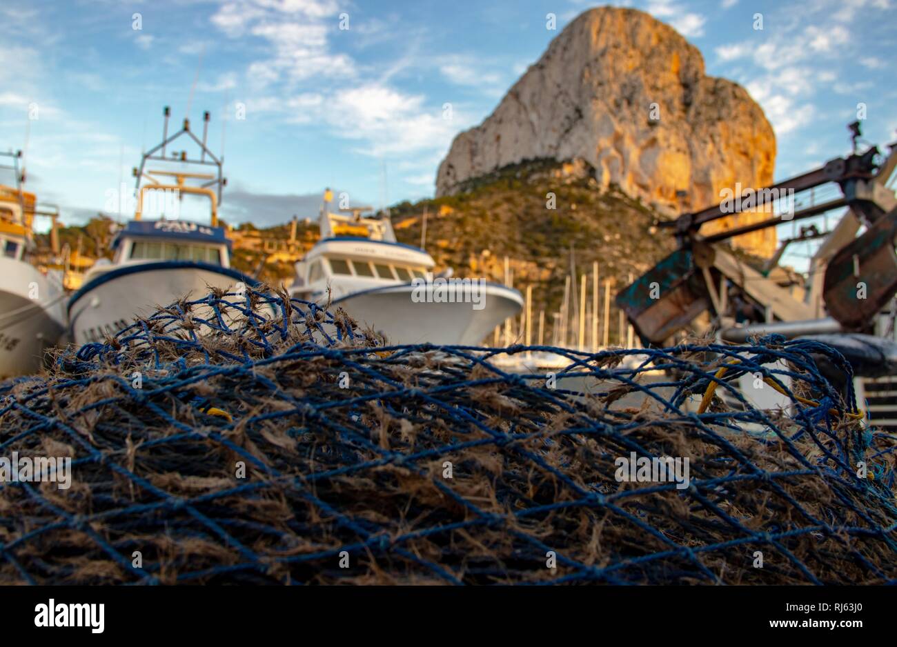Fishing boats and fishing nets prepared to work in calpe Stock Photo ...