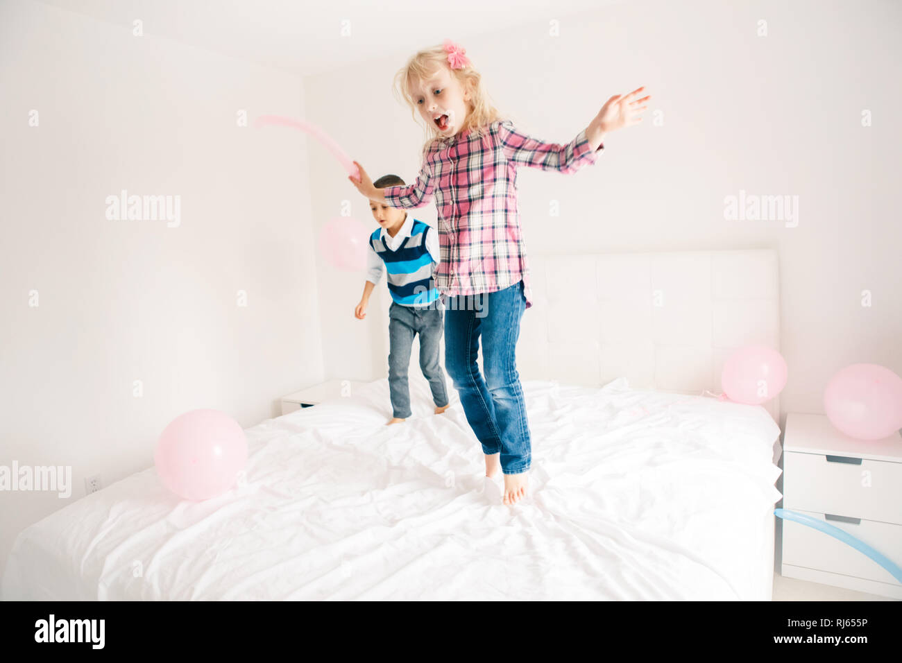 Two Caucasian Cute Adorable Funny Children Jumping On Bed In Bedroom And Playing Boy And Girl Are Having Fun Fighting With Balloons Best Friends For Stock Photo Alamy Two Caucasian Cute Adorable Funny Children Jumping On Bed In Bedroom And Playing Boy And Girl Are Having Fun Fighting With Balloons Best Friends For Stock Photo Alamy