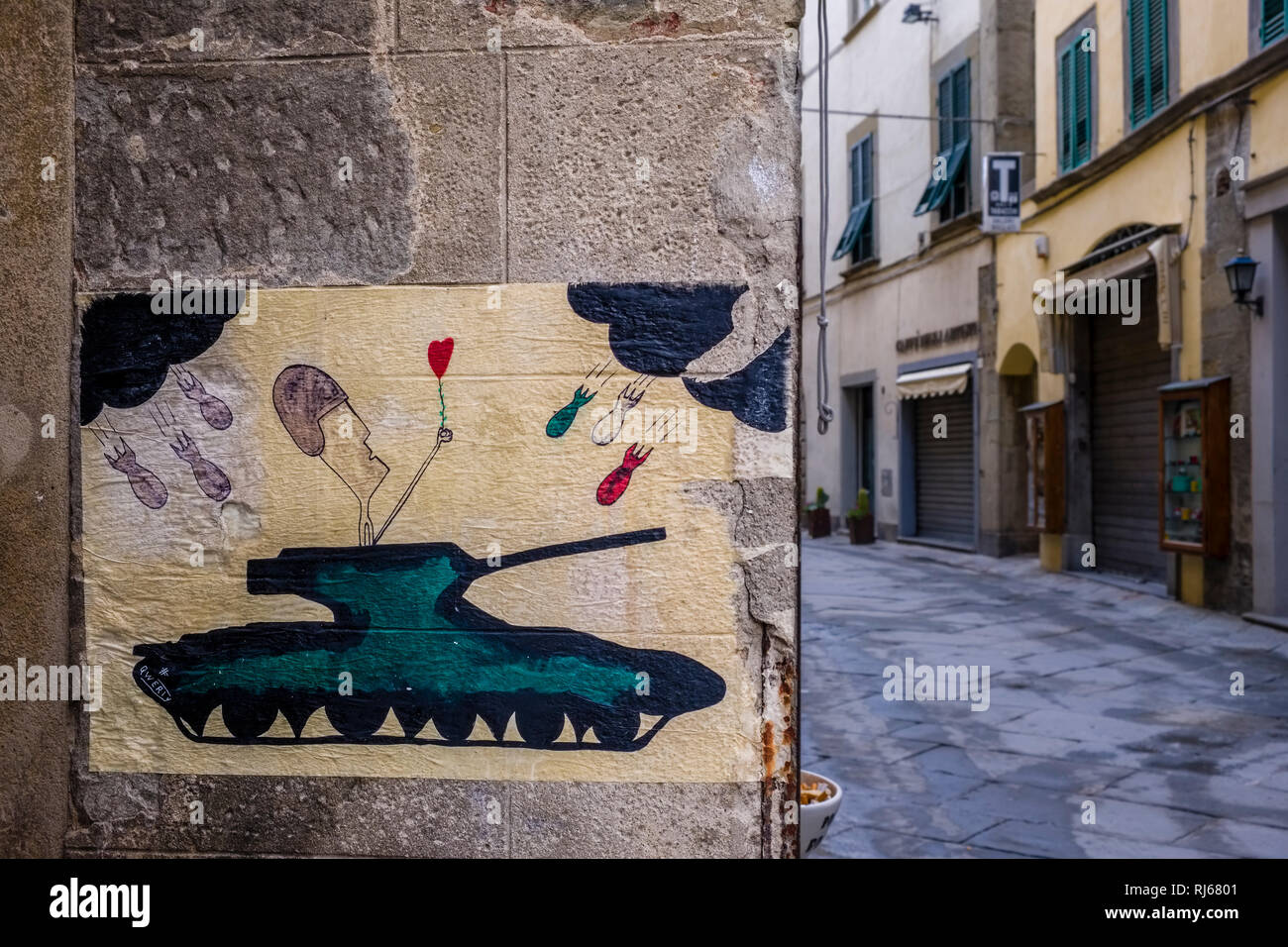 Artful anti war painting at a house of the medieval town Stock Photo