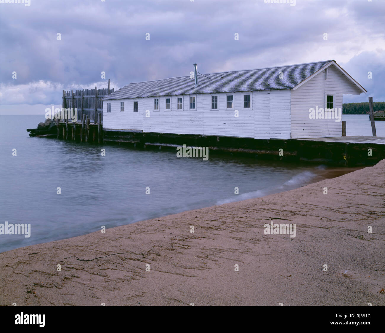 USA, Wisconsin, Apostle Islands National Lakeshore, Historic fishing shack at Little Sand Bay and Lake Superior. Stock Photo