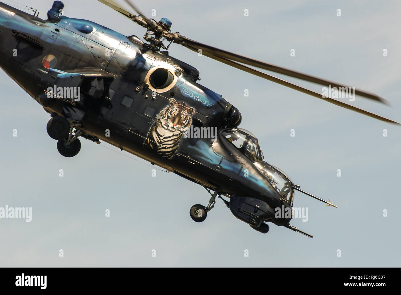 Czech AF Mil Mi-24 (NATO reporting name Hind) is a large helicopter gunship, attack helicopter and troop transport. Russian Soviet era. Tiger scheme Stock Photo