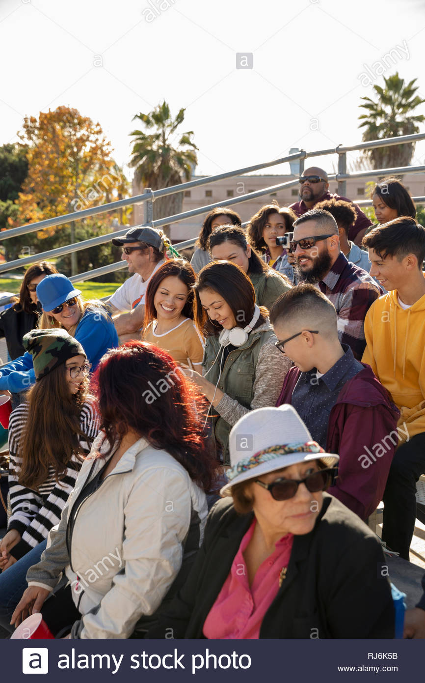 Latinx fans in bleachers at baseball game Stock Photo Alamy