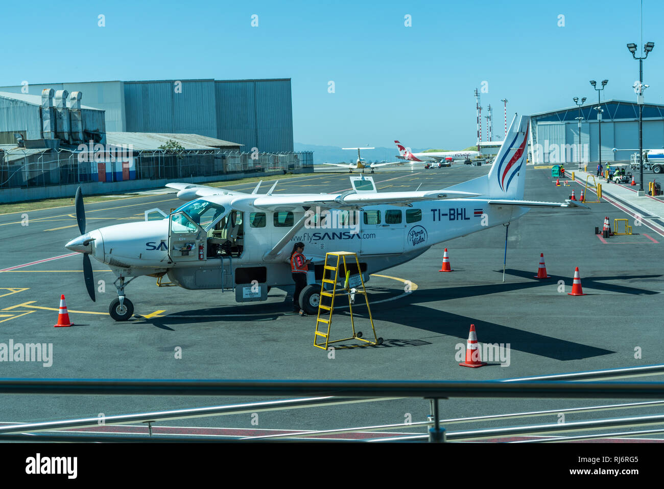 A photo of a Cessna 208 Caravan (Cessna Grand Caravan) operated by Sansa Airlines is docked at the Juan Santamaria International Airport, San Jose. Stock Photo
