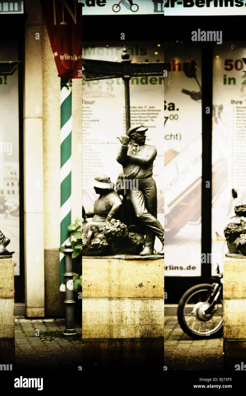 Berlin, Deutschland, eine alte Skulptur und Wegweiser mit einem Arbeiter der in eine Richtung zeigt Stock Photo