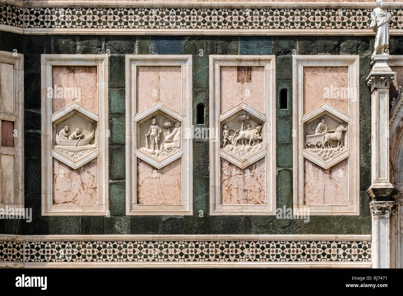 Artful rock carvings at the entrance gate of Florence Cathedral, Cattedrale di Santa Maria del Fiore, Doumo Stock Photo