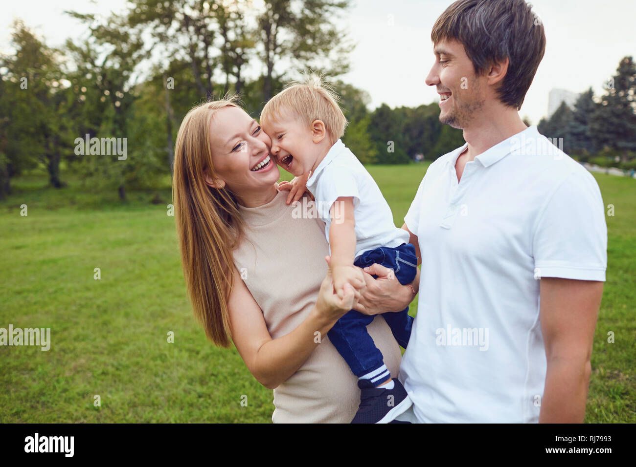 Happy family is laughing in the park. Stock Photo