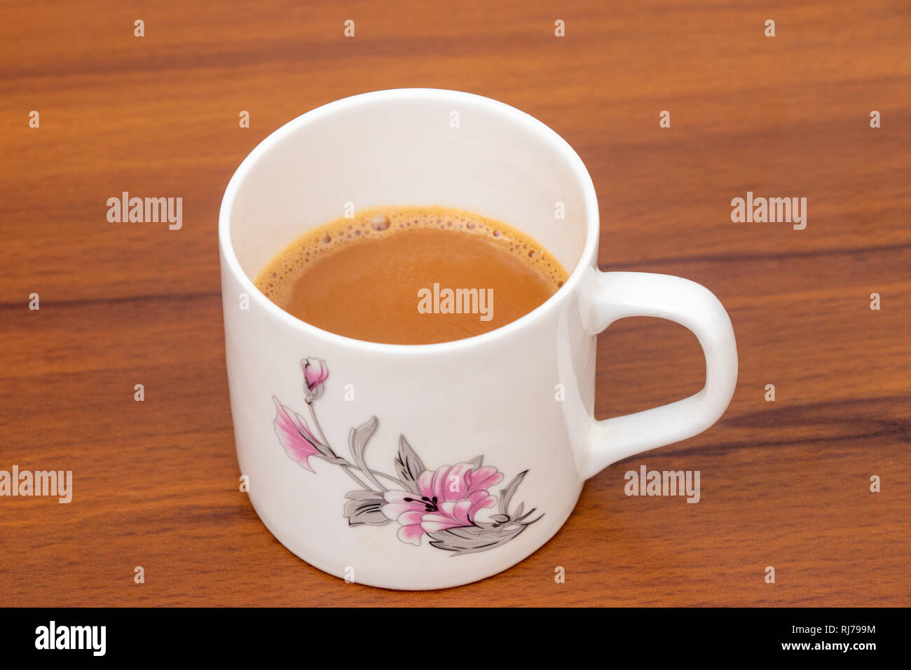 Masala indian Tea Chai hot in a white cup on a wooden background, Cup of tea Stock Photo