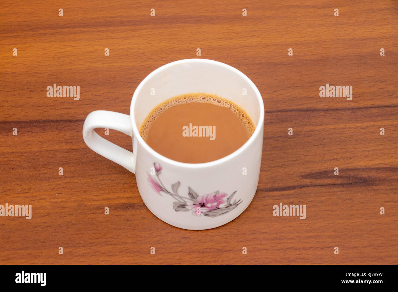 Masala indian Tea Chai hot in a white cup on a wooden background, Cup of tea Stock Photo
