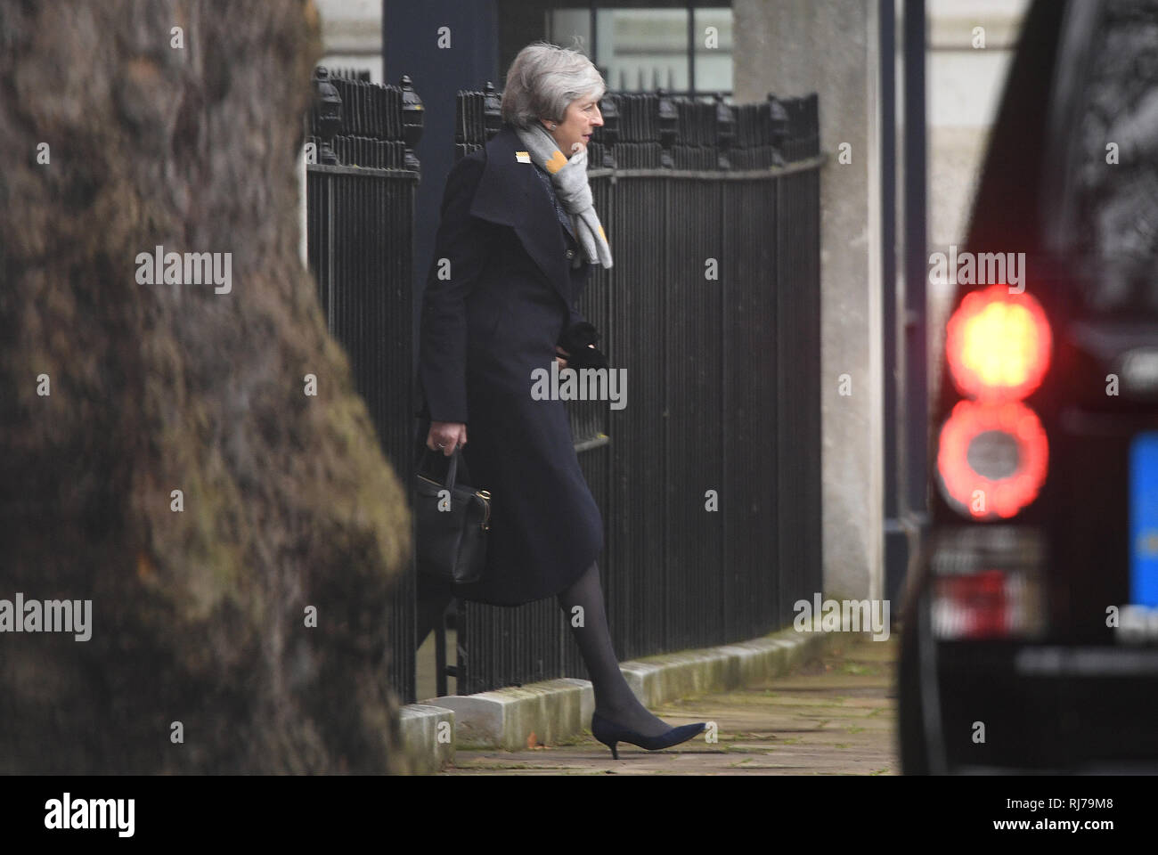 Prime Minister Theresa May leaving Downing Street to travel to Northern Ireland to make a high-profile speech where she will insist that she can secure a Commons majority for a Brexit deal that 'commands broad support' in the province. Stock Photo