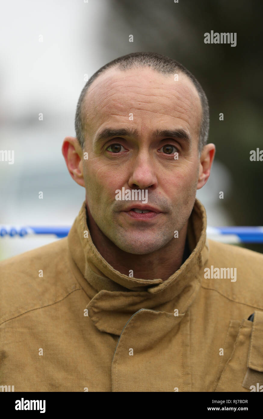 Rob Barber, deputy chief fire officer for Staffordshire Fire and Rescue Service, speaks to the media at the scene of a house fire in Sycamore Lane, Stafford, which claimed the lives of four children. Stock Photo