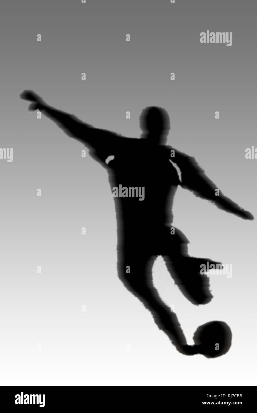 Der Umriss und die Illustration eines Fußballspielers während eines Schusses. Stock Photo