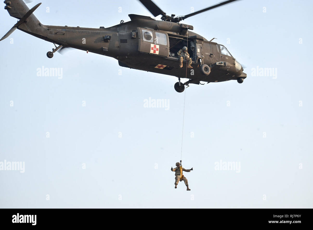 Soldiers with 5th Battalion, 20th Infantry Regiment, practice hoist operations at Camp Nimman Kolayut, Thailand. The training included medical evacuation procedures with the 2nd Battalion, 25th Aviation Regiment. This was part of Hanuman Guardian, a training exercise designed to increase readiness, interoperability and collaboration among partner nations in order to achieve effective solutions to common challenges. (U.S. Army photo by Sgt. Kyle Steinhilber) Stock Photo