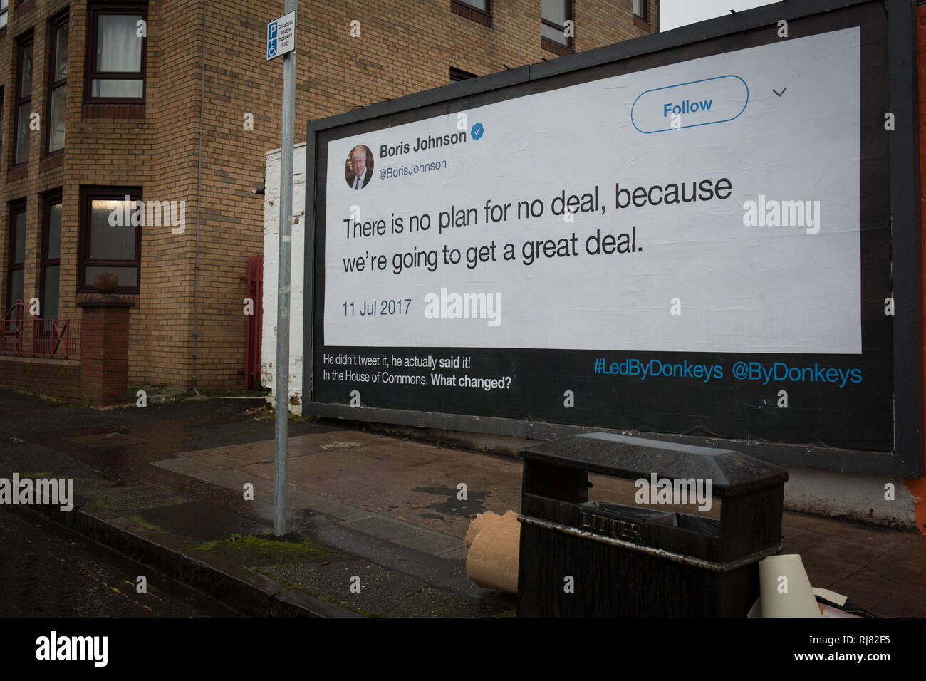 Glasgow, Scotland, 5th February 2019. Billboard by the anti-Brexit group 'Led By Donkeys', showing a quote from Conservative Party MP Boris Johnson in which he talks of the great deal Great Britain would get on leaving the EU, in the East End of Glasgow, Scotland, 5 February 2019. The guerilla billboard campaign is the initiative of six friends who crowdfunded money to be able to post what they believe are the 'country's biggest lies'.  Image Credit: Jeremy Sutton-Hibbert/Alamy Live News. Stock Photo